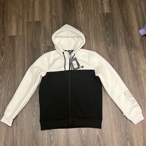 DKNY Black and white Hoodie, Super comfy with DKNY logo across the left sleeve.